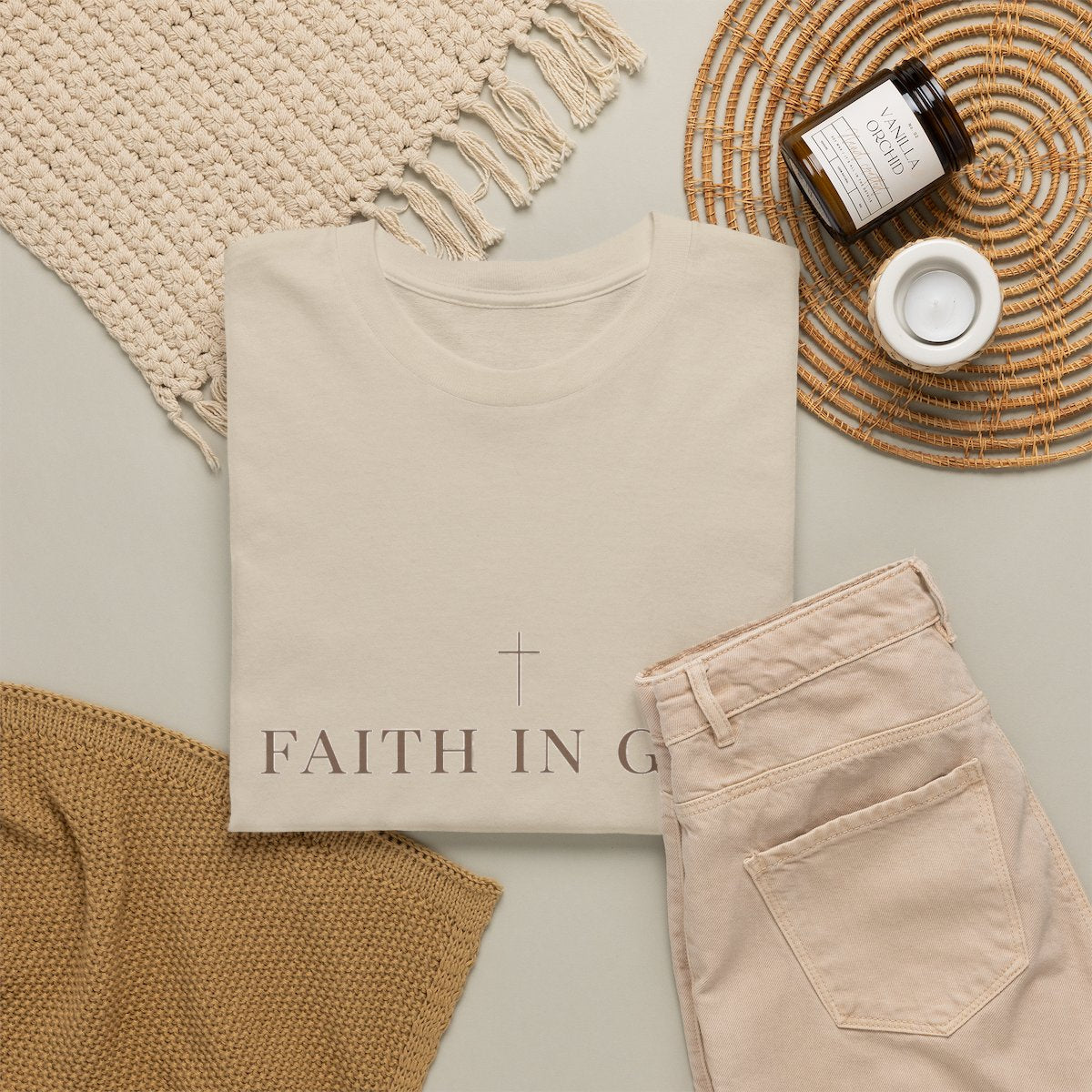 Saints Supply Co Faith in God graphic tee, Sand, flat lay view